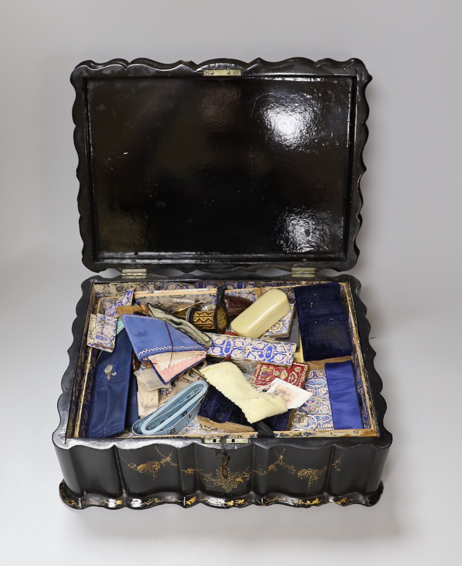 A Victorian papier mache workbox and contents, 32cm